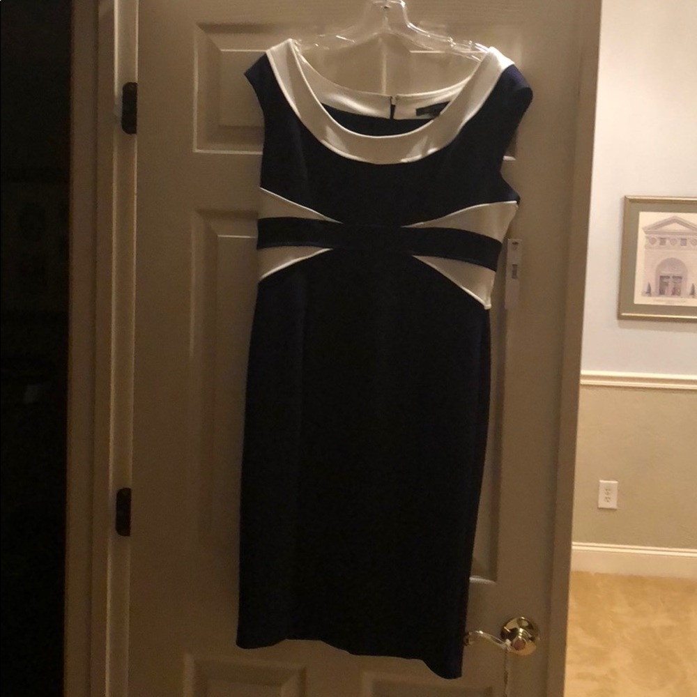 Tags Attached. Well made, very nice dress.